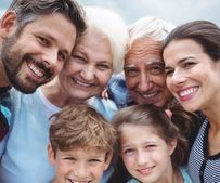 Portrait of happy multi-generation family standing outdoors___serializ